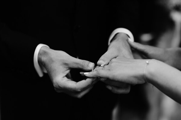 Wedding Photographer in Italy: Groom puts bride on engagement ring