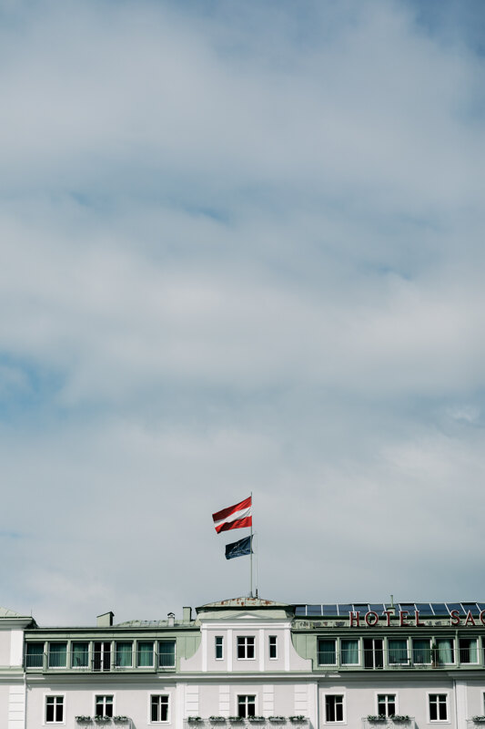 Wedding photography portfolio in Italy: Bright flag hanging over the hotel building