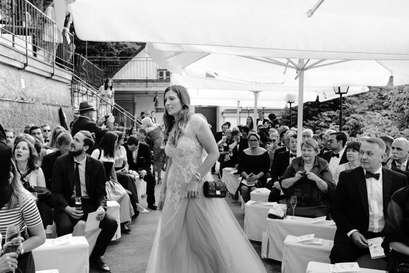Wedding photography portfolio in Italy: Guests are sitting on the hotel terrace awaiting the start of the wedding