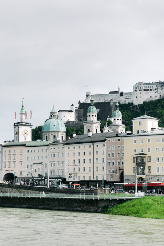 Wedding photography portfolio in Italy: Small houses and a church with large domes above the river