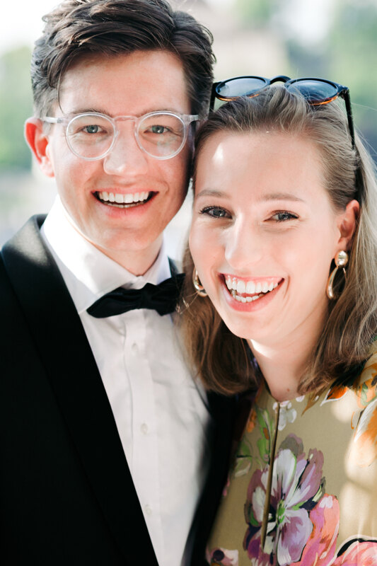 Wedding photography portfolio in Italy: Portrait of a couple, a man in glasses with a transparent frame and a girl, sincerely smiling