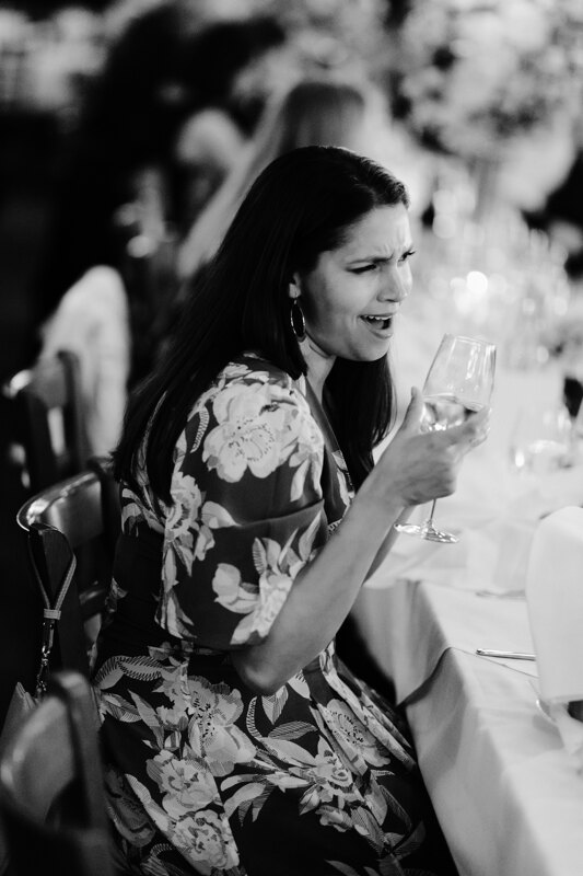 Wedding photography portfolio in Italy: Girl sitting at the table and smiles broadly