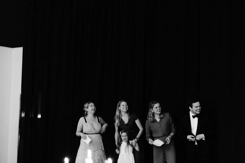 Wedding photography portfolio in Italy: Guests are smiling and watching the celebration