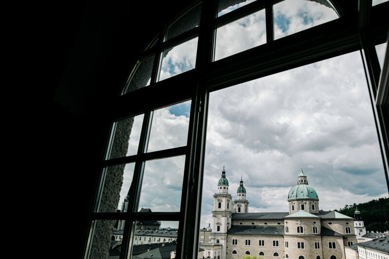  Wedding photography portfolio in Italy: Beautiful huge domes of the church can be seen from the window of the building