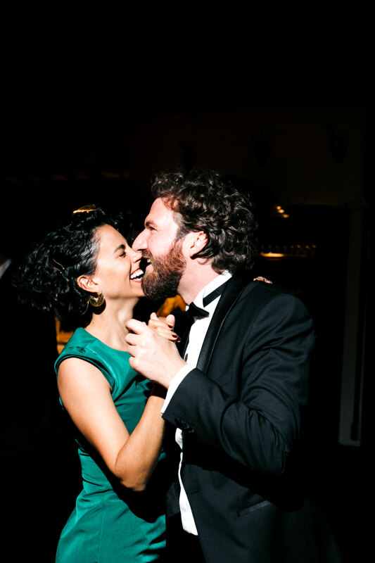 Wedding photography portfolio in Italy: The couple dances a slow dance and sincerely smile at each other