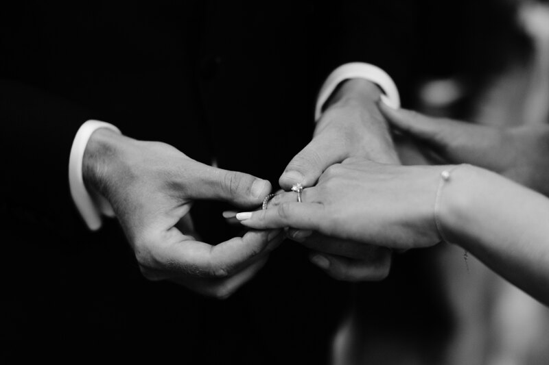 Wedding photography portfolio in Italy: Groom puts a ring on the finger of his beloved