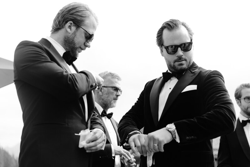 Wedding photography portfolio in Italy: Men in black tuxedos and glasses.