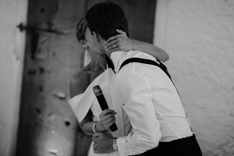 Wedding photography portfolio in Italy: Passionate kiss of the couple, after the touching words of the bride