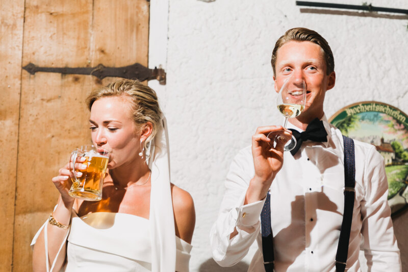 Wedding photography portfolio in Italy: In the photo the bride is drinking beer, and the groom is champagne
