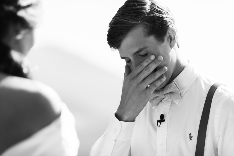 Wedding Photographer in Venice: the moment where the bridegroom could not hold back the emotions from the words of the vow to his beloved and wipes tears from his face