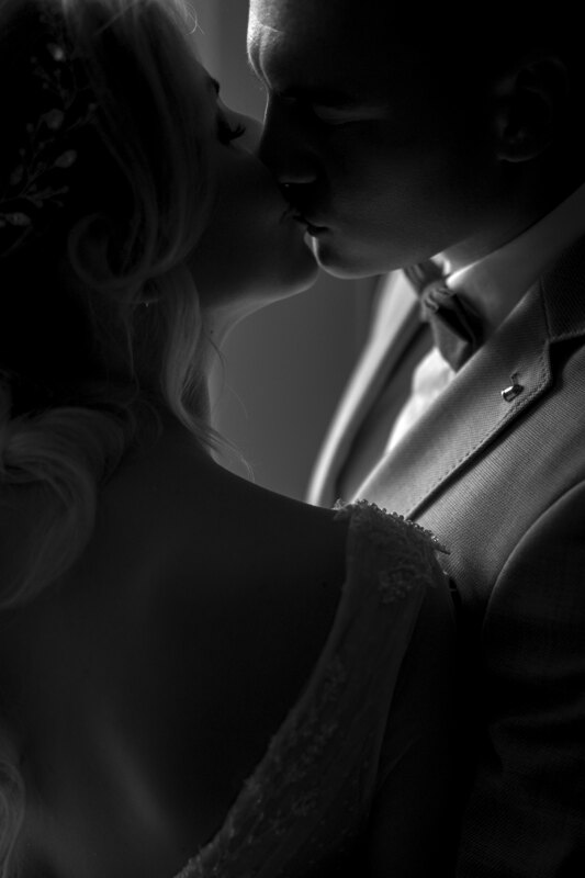 Wedding Photographer in Naples: Gentle Kiss of the Bride and Groom in Black and White Photography