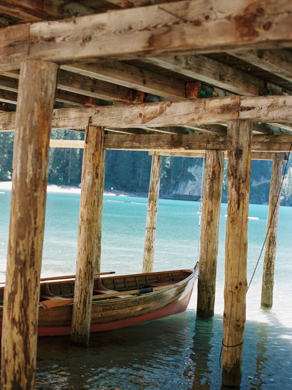 Wedding photography portfolio in Italy: Old wooden pier on the shore of a mountain lake in the Dolomites