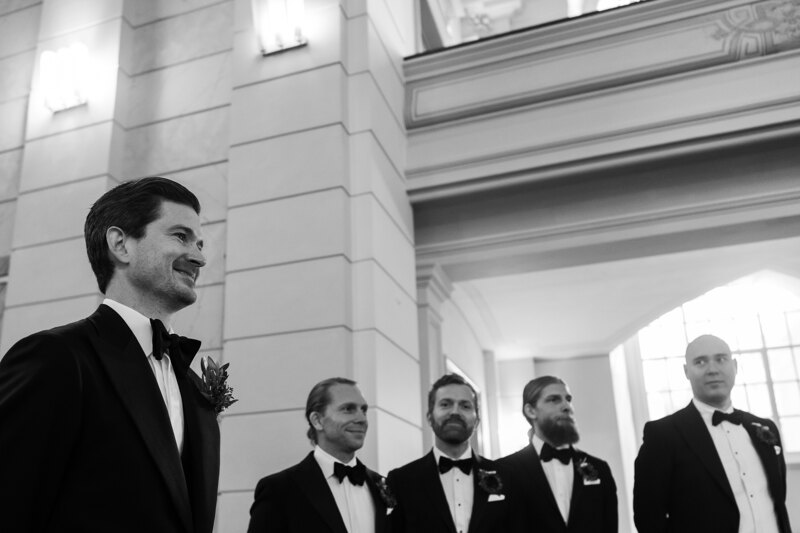 Wedding photography portfolio in Italy: The groom is looking forward to when the bride enters the festive hall