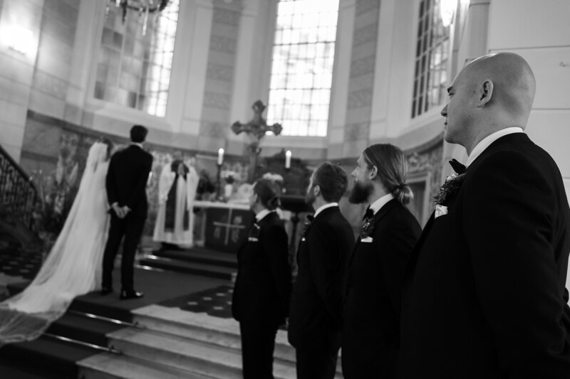 Wedding photography portfolio in Italy: The bride and groom stand in front of the altar in the church