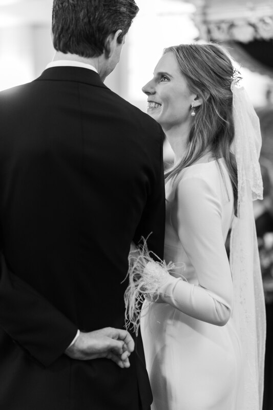 Wedding photography portfolio in Italy: The bride with a loving look and a smile on her face looks at her beloved