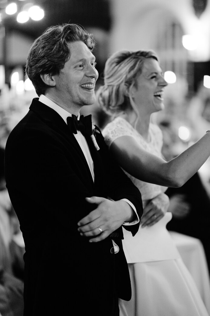 Wedding photography portfolio in Italy: Sincere and smiling bride and groom receive congratulations from their guests