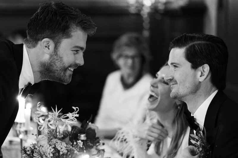 Wedding photography portfolio in Italy: One of the guests approached the newlyweds and with a sincere smile welcomes them with marriage