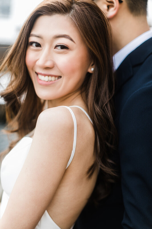 Couple photoshoot in Italy: Portrait of a smiling bride with an interesting oriental appearance