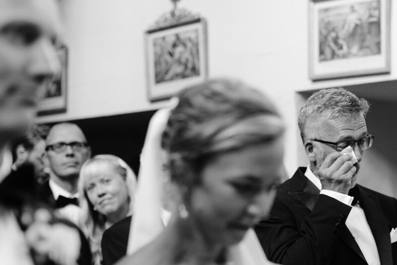 Wedding photography portfolio in Italy: A man wipes his tears with a handkerchief