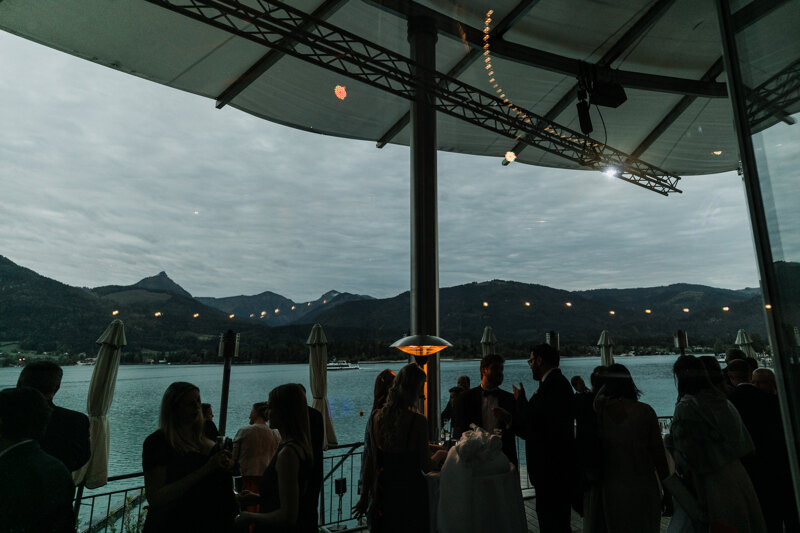 Wedding photography portfolio in Italy: Hotel evening terrace on which guests have fun