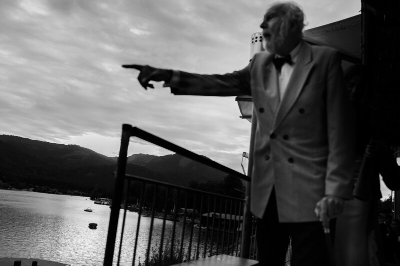Wedding photography portfolio in Italy: Mature man points finger to the side